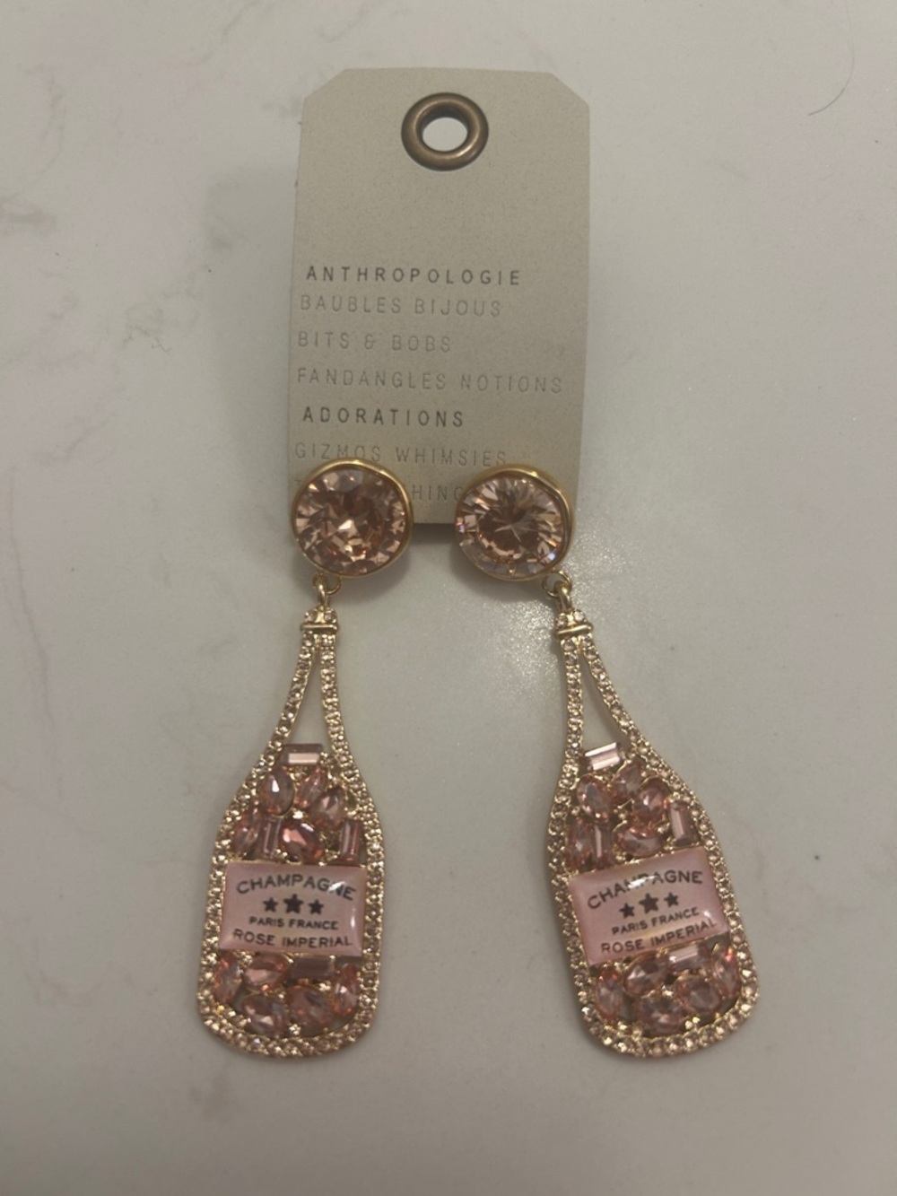 Anthropologie Gold-Tone Champagne Bottle Drop Earrings with Pink Crystals